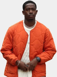damson idris f1 the movie orange jacket.