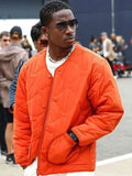 damson idris f1 the movie orange jacket
