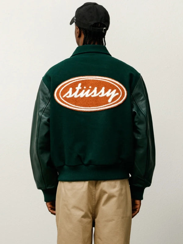 stussy script oval varsity jacket...