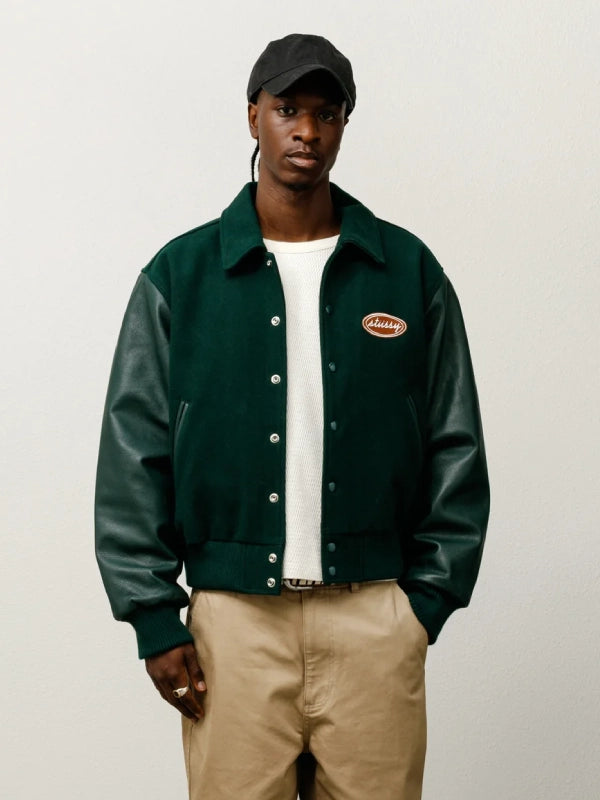 stussy script oval varsity jacket