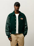 stussy script oval varsity jacket